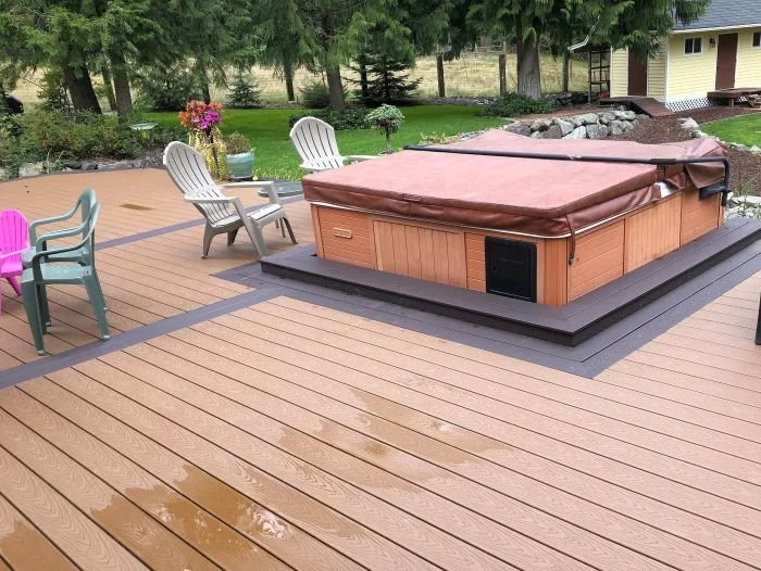 Load-rated deck platform designed for a hot tub with reinforced framing and integrated seating area