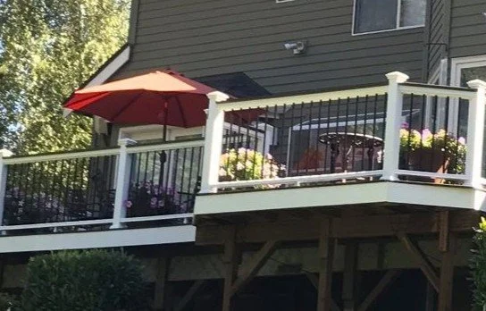 Custom deck construction project with black aluminum railings and outdoor living space in King County, WA