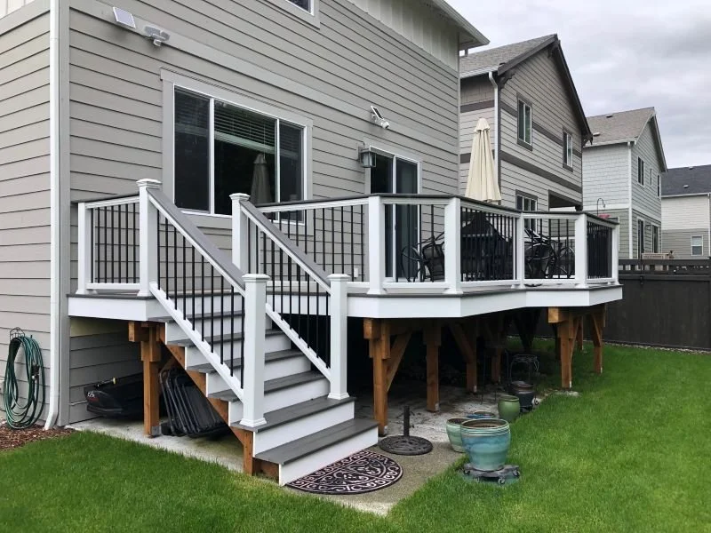 Metal railing system with vertical infill on an elevated residential deck