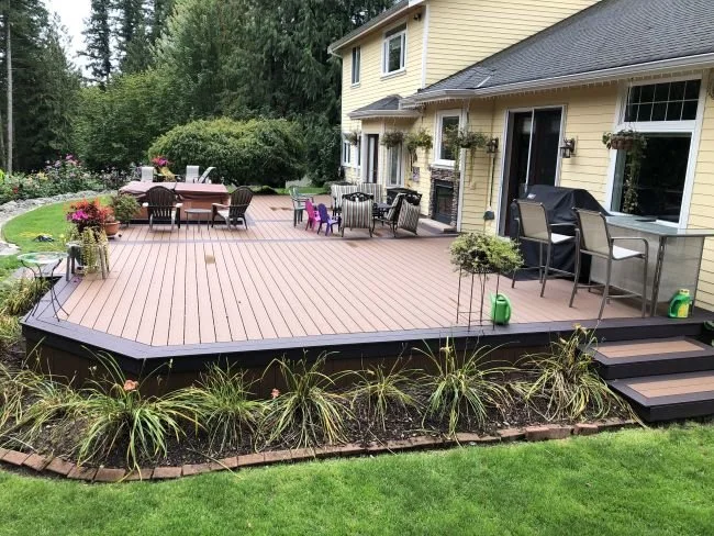 Custom composite decking installation creating a spacious, low-maintenance outdoor living area in King County, WA.
