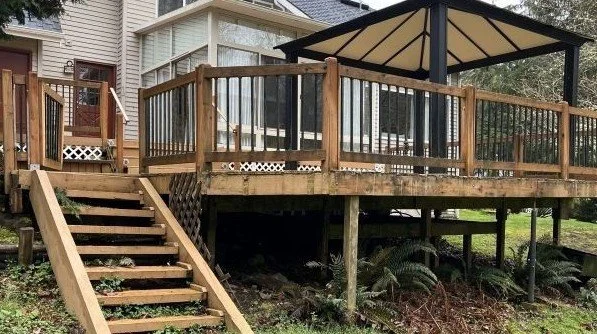 Existing cedar deck and aging stairs before structural upgrades and cedar deck replacement in Renton, WA.