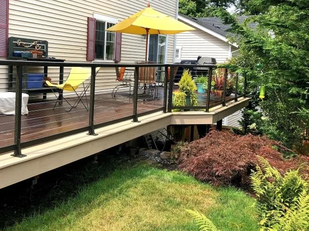 Deck renovation with updated railing system and refreshed decking surface