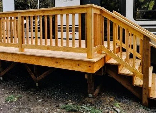 Cedar deck construction in Auburn WA with stairs and wood railing for trailer setup