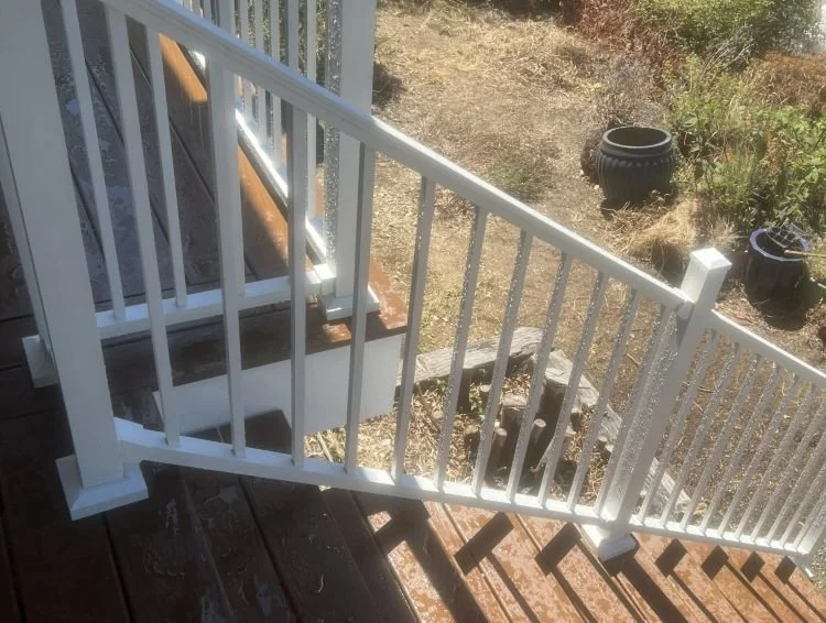 White Trex Signature aluminum railing installed on rebuilt deck stairs in Renton