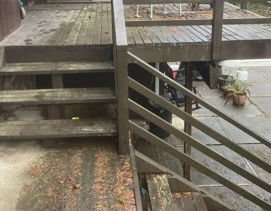 Aging wood deck with moisture damage before deck replacement in Maple Valley, WA