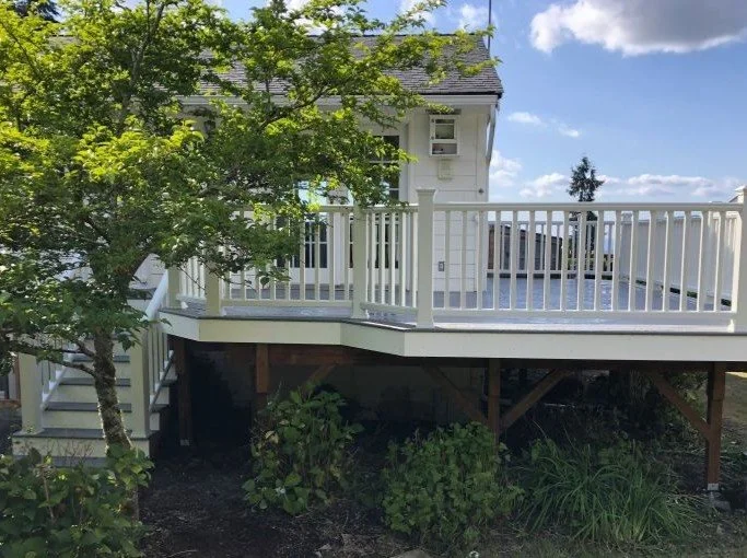 Elevated custom deck built with structural framing, reinforced support posts, and composite railings in King County, WA.