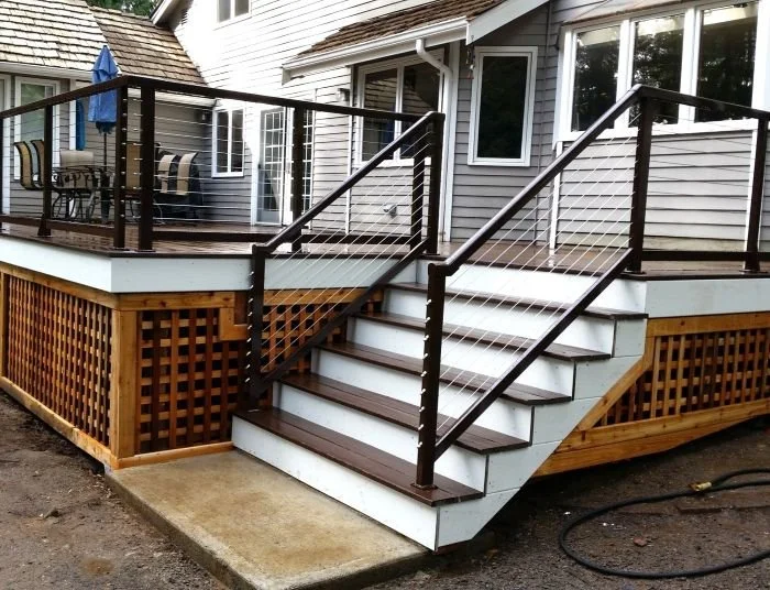 Cable railing system with stainless steel infill on deck and stair sections