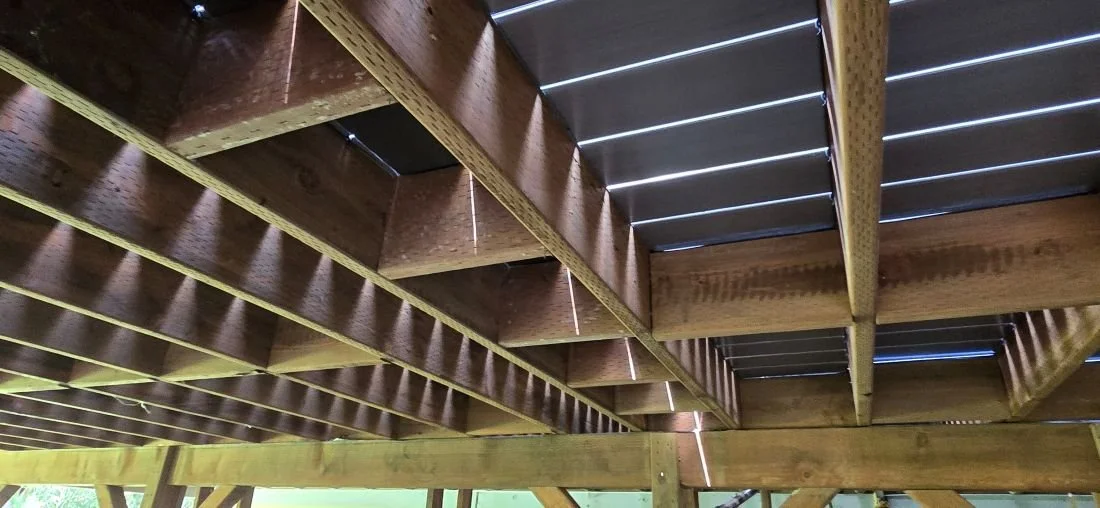 Structural framing beneath PVC deck replacement project in Maple Valley, WA showing reinforced joists and upgraded deck support system during rebuild process