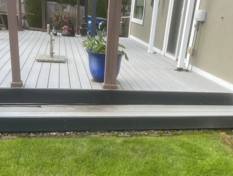 Existing deck in Kent without stairs showing limited yard access and elevation gap
