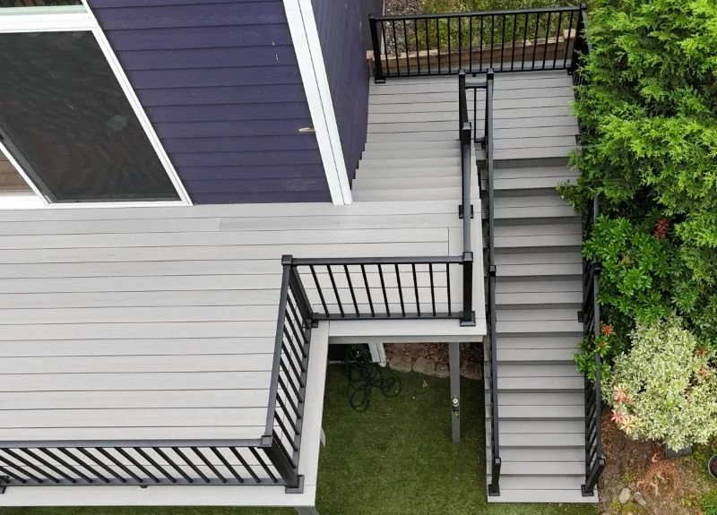Black aluminum deck railing installation across multi-level deck and stairs, Snoqualmie, WA