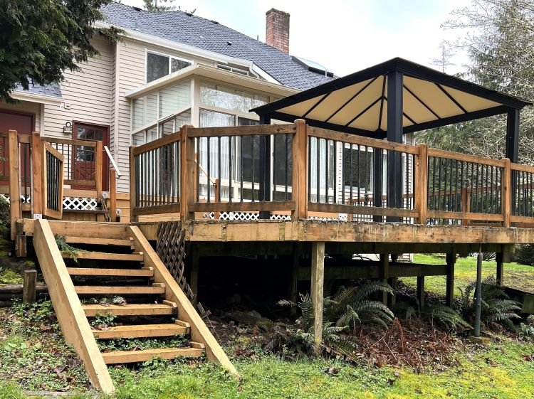 Existing wood deck before renovation with aging cedar boards and stairs in Renton, WA