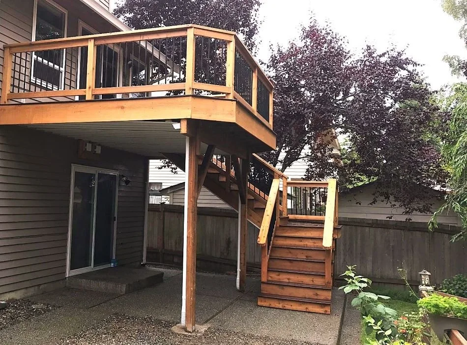 Under-deck waterproofing integrated beneath an existing elevated deck
