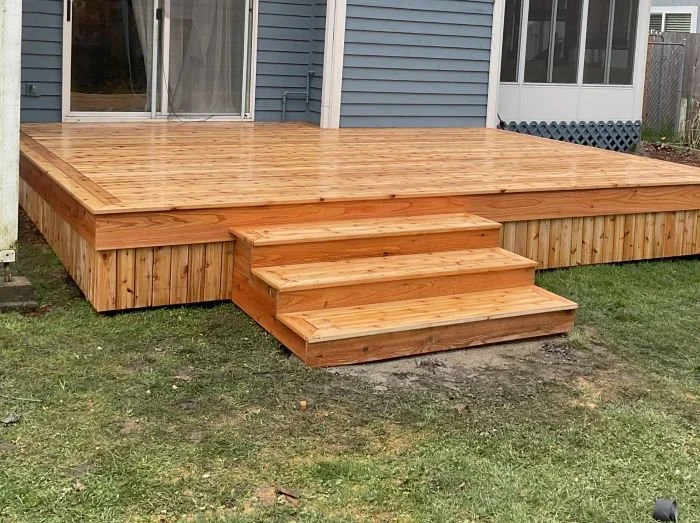 New cedar deck in Auburn, WA with rebuilt stairs and updated structure after full deck replacement