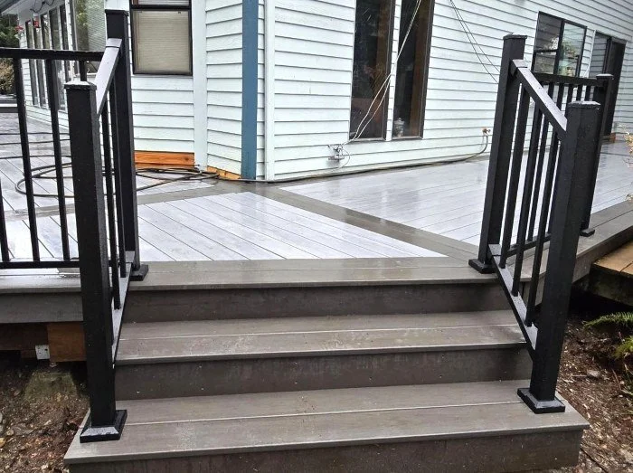 PVC deck replacement stairs in Kent WA with black aluminum railing