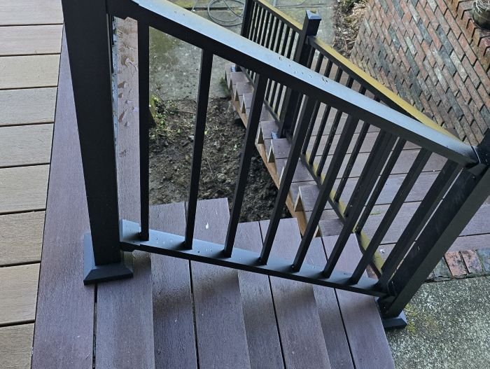 Composite deck stairs with black Trex Signature aluminum railing in Maple Valley, WA