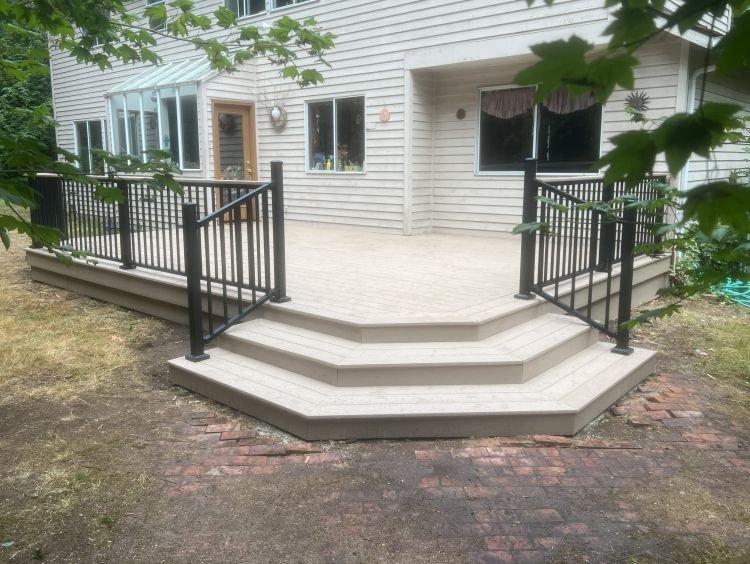 Completed deck replacement project in East Hill, Kent featuring TimberTech PVC decking and Trex railing