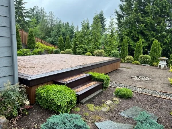 Completed composite deck project with custom stairs and low-maintenance outdoor living space in Bellevue, WA.
