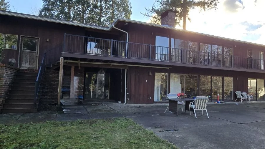 Recent deck replacement project in Maple Valley WA with elevated structure, new railing system, and stairs built for long-term durability