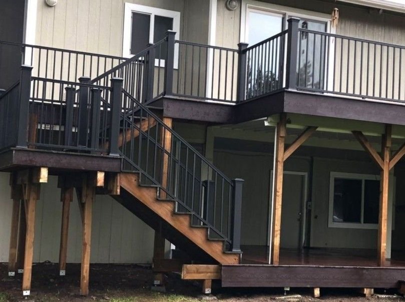 Custom deck construction and replacement with composite decking, aluminum railings, and stairs by Petra Decks in King County, WA.