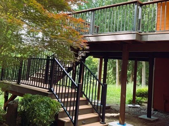 Multi-level deck replacement in Sammamish WA with stairs, railing, and structural rebuild for hillside conditions