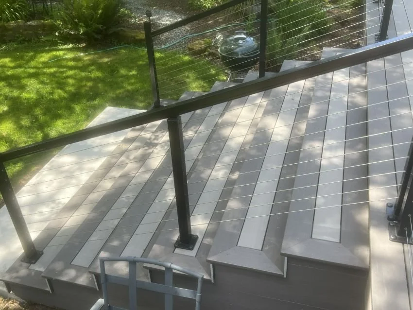 Completed PVC deck replacement in Sammamish, WA featuring cable railings, custom stairs, and low-maintenance decking.