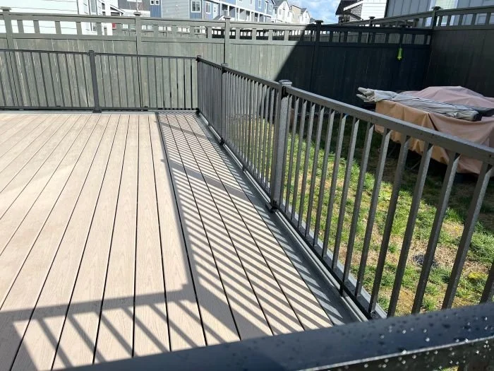 Deck railing installation along the perimeter of an existing residential deck