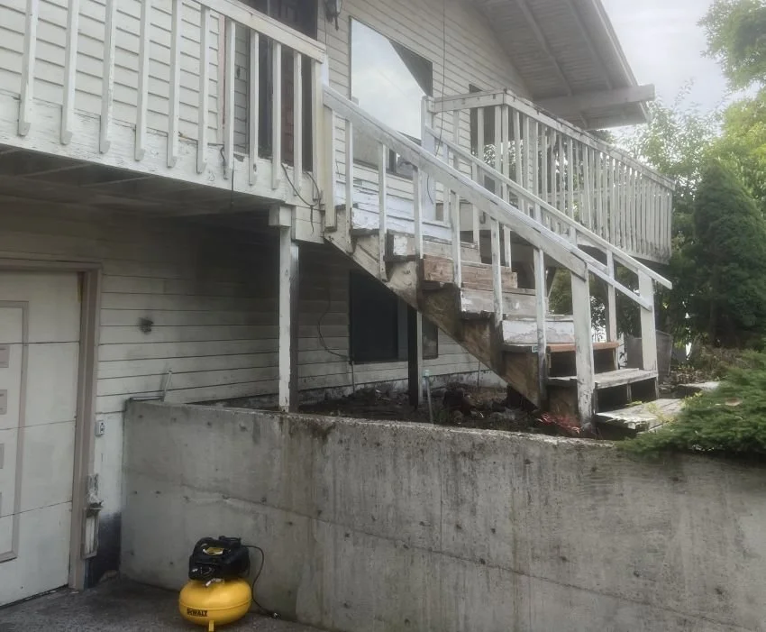 Existing weathered wood deck and stairs before replacement in Renton