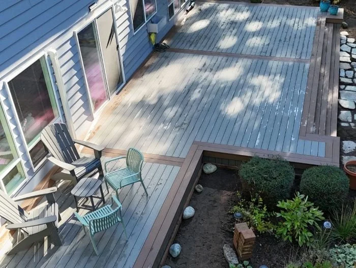 Large composite deck replacement in Sammamish with multiple stairs and two-tone TimberTech decking