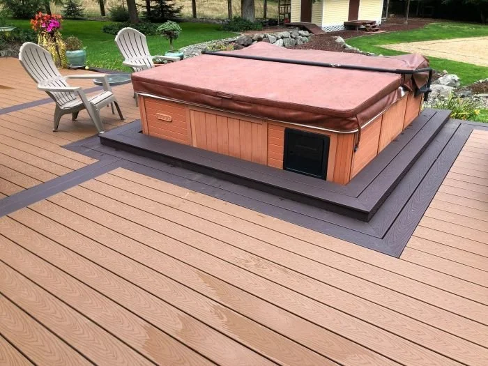 Custom hot tub deck construction featuring a reinforced composite deck with an integrated hot tub platform built by Petra Decks in King County, WA.