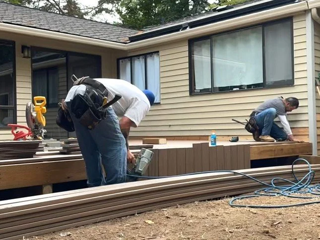 Petra Decks crew installing wood framing during a residential deck construction project.