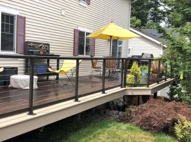 Completed residential deck railing installation by a licensed contractor