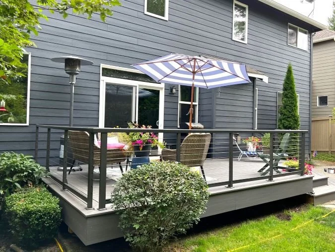 Deck renovation with updated surface and railing by Petra Decks in King County