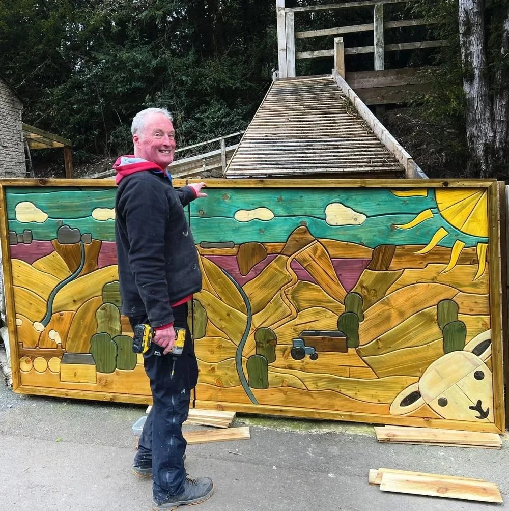 Alan the craftsman with his newly built fence.