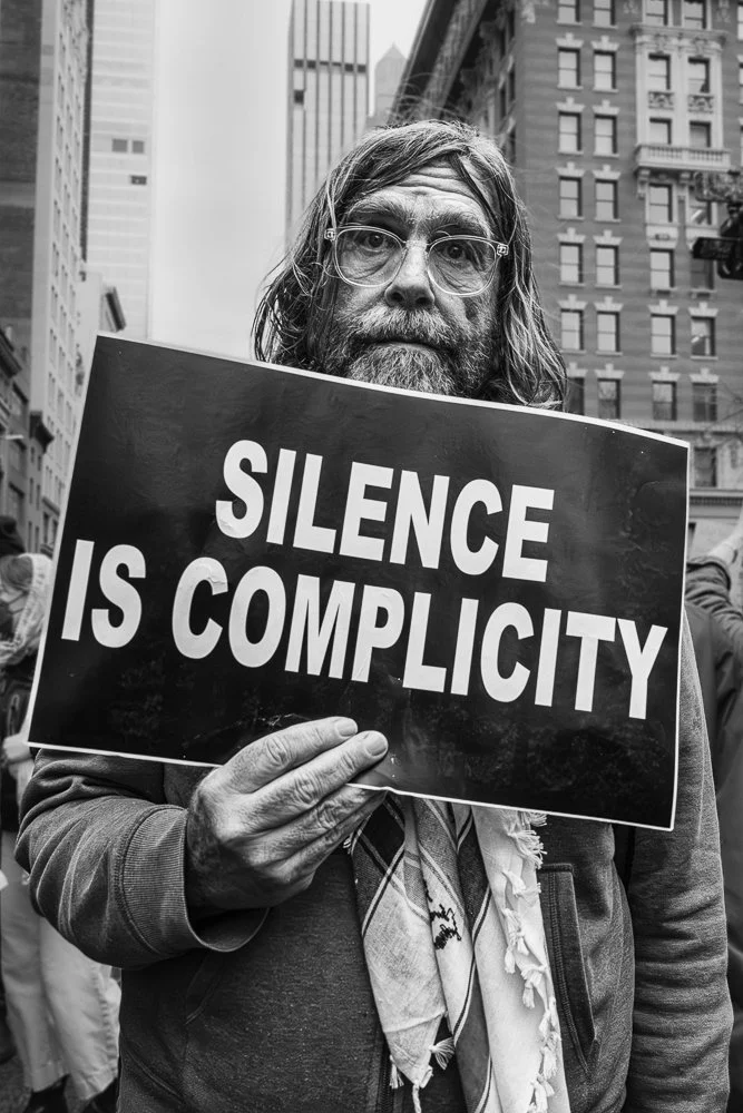 Silence Is Complicity (Color version, Hands Off! Series)-2025 International Photography Awards 3rd Place and PX3 State of the World Finalist; Single, PX3 Silver Medal, IPA Honorable Mention, B+W version, 2025 Black and White Spider Awards Honorable M
