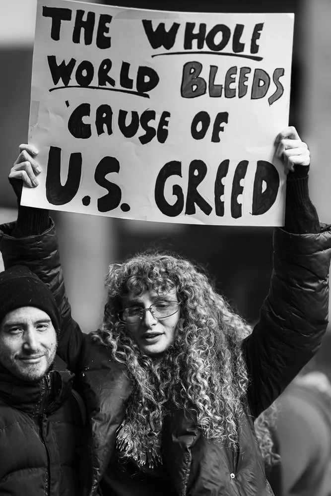 The Whole World Bleeds Because of U.S. Greed (28 March 2026 NYC No Kings! Protest)-2026 International Photography Awards Honorable Mention, Editorial/Press Political Professional Category