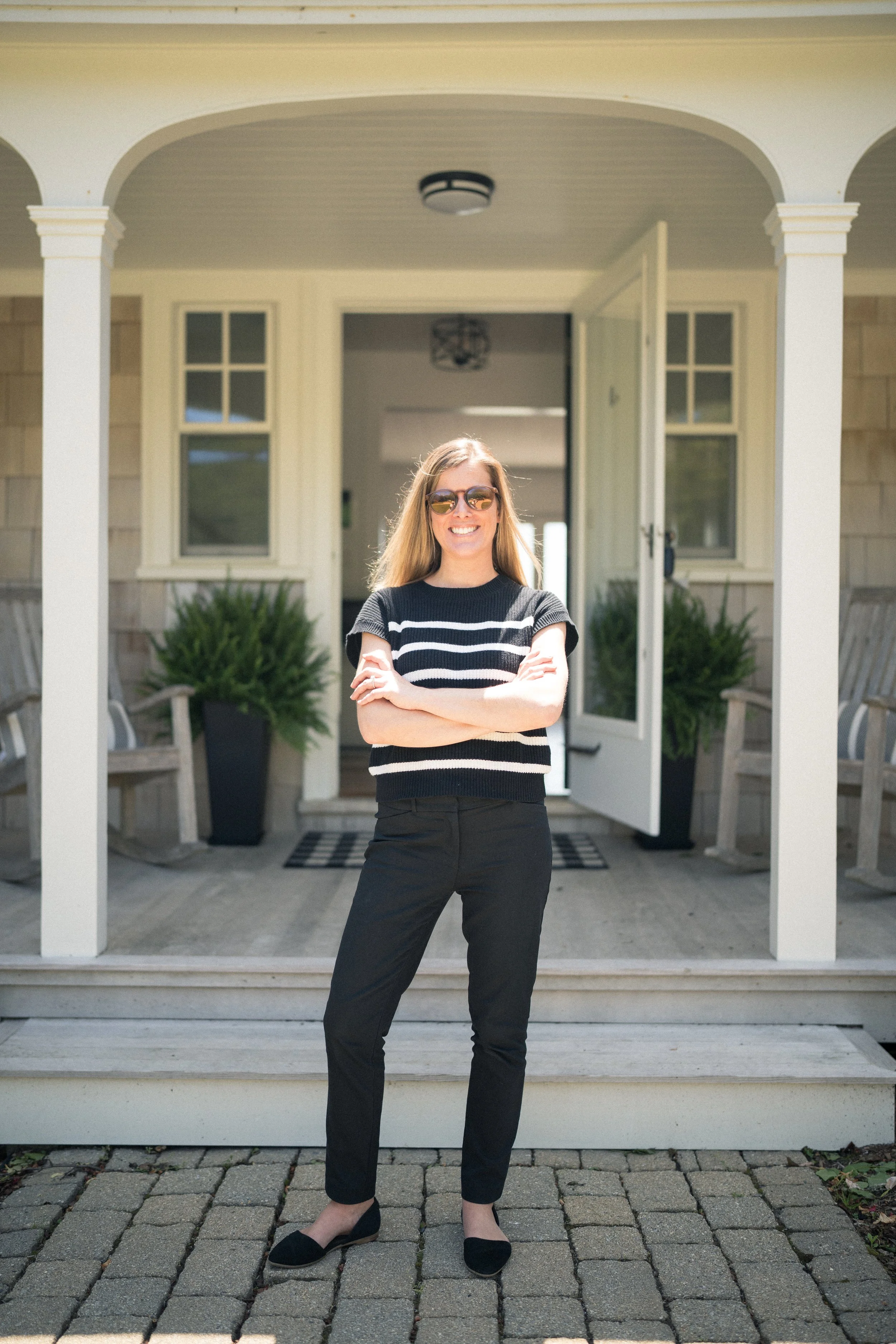 Lifestyle Photo, Professional standing outside home in a powerful pose