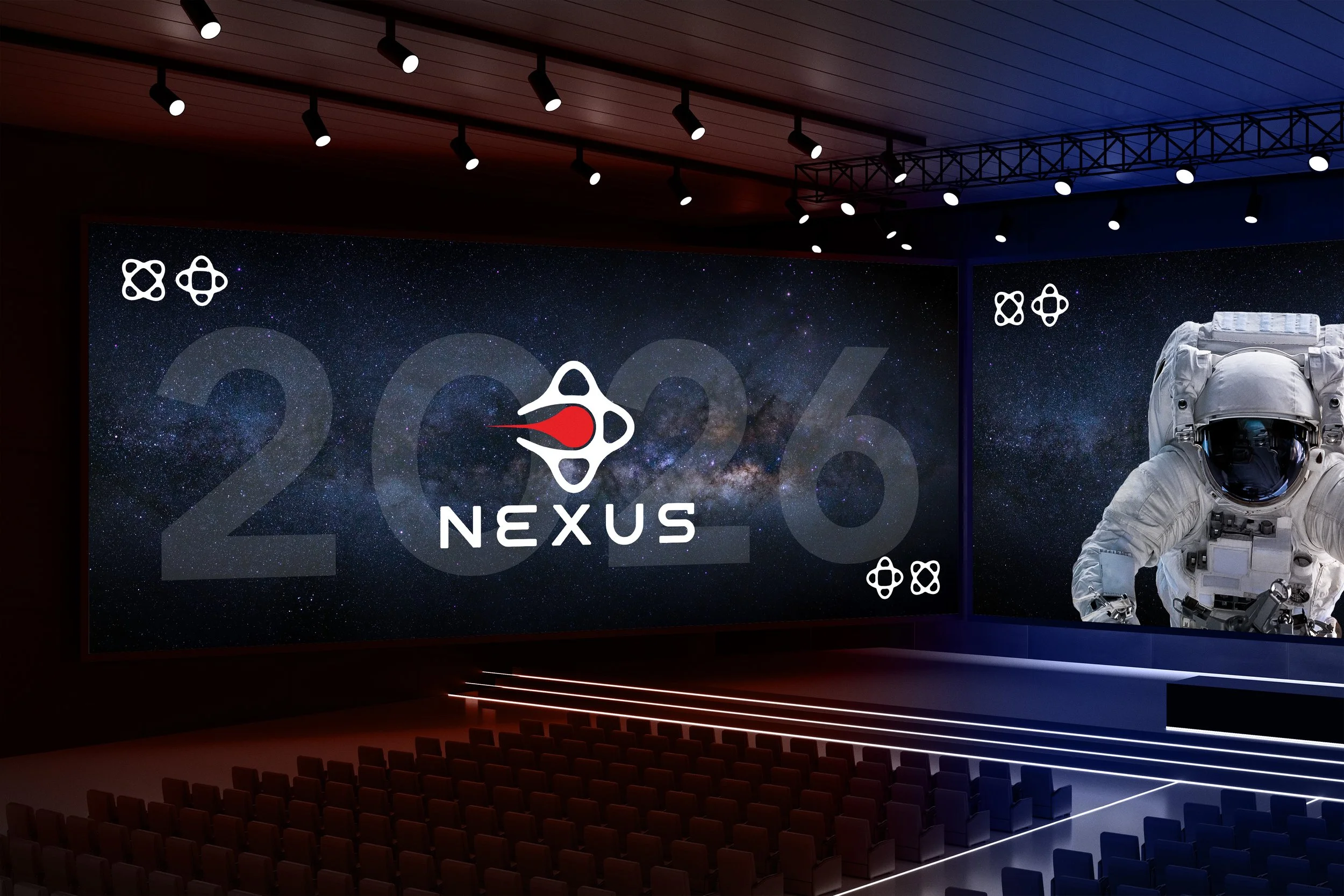 An auditorium with a large screen displaying the logo and name 'Nexus 2006' against a starry space background, with a NASA astronaut in a spacesuit on the right side, and rows of empty seats in front.