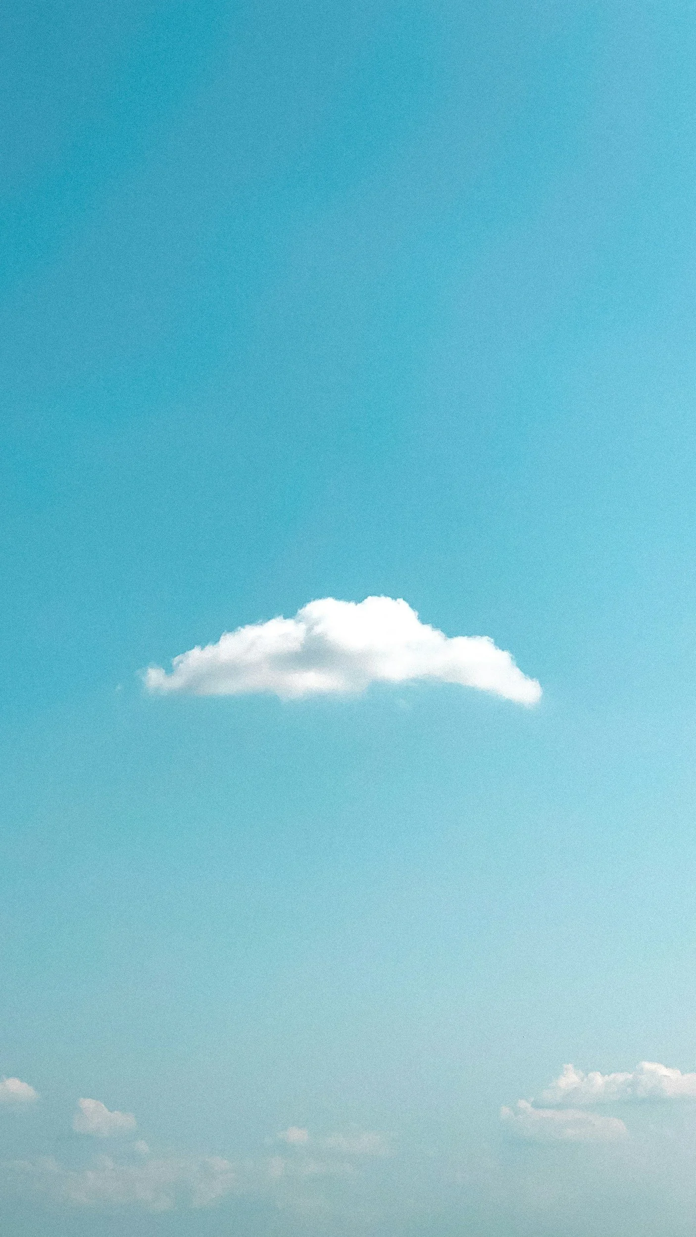 Blue sky with a few white clouds.