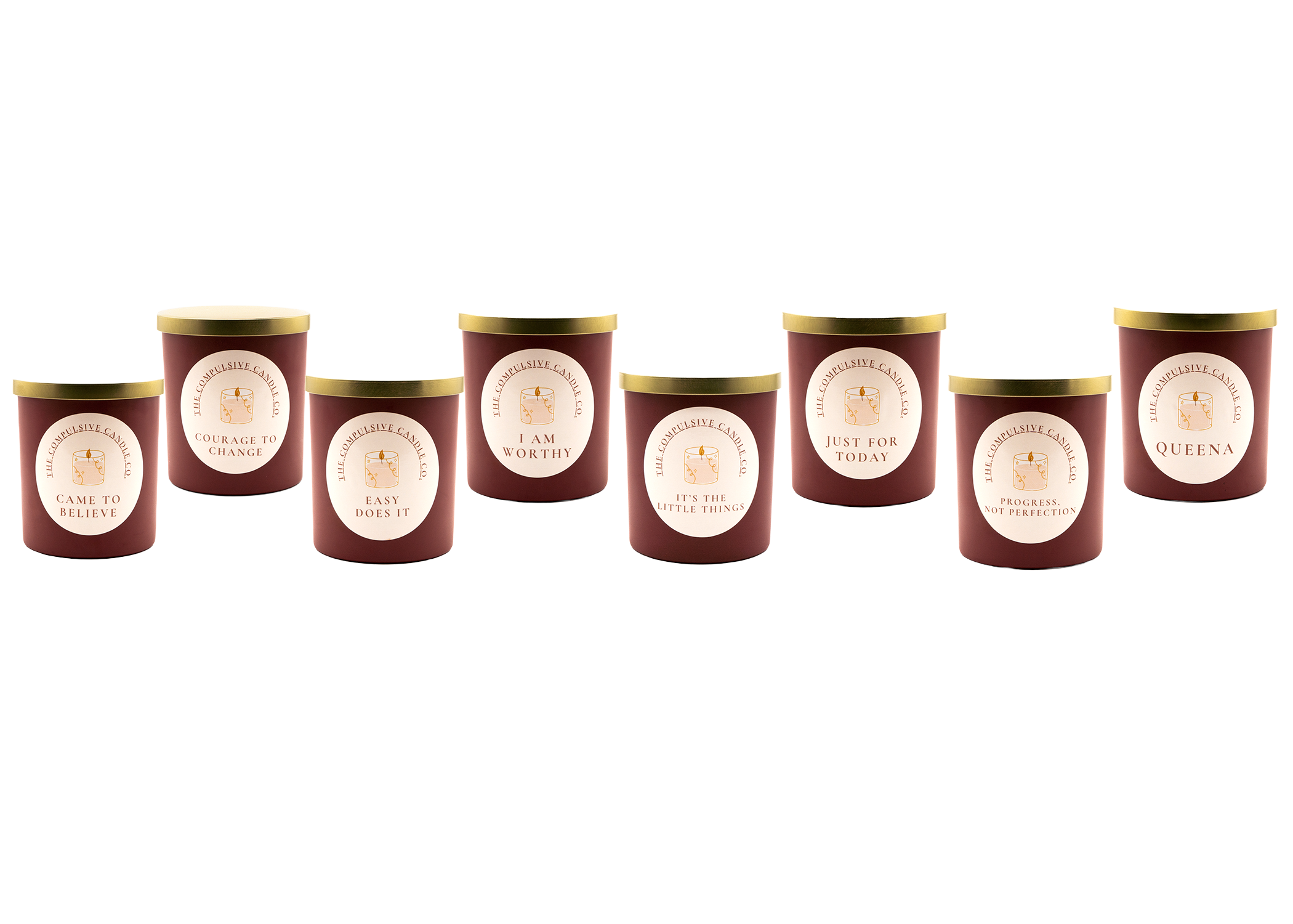 Seven candles in red containers with gold lids, each with a motivational phrase on the label, arranged in a row.