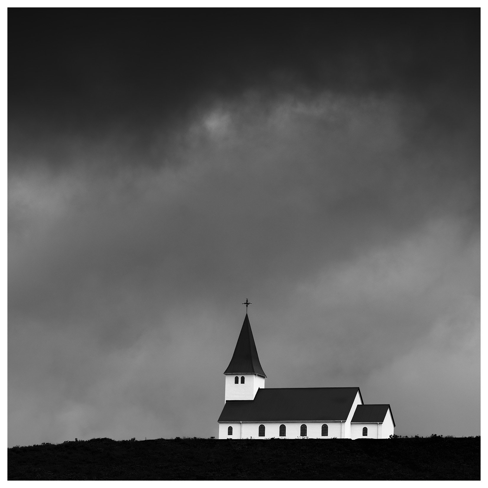 Fine Art Black and White Landscape photograph of Vikurkirkja Church, Vik, Iceland.