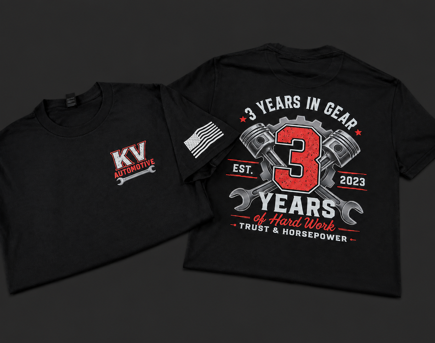 Two black DTF T-shirts lying flat on a dark surface. The front of one shirt features a logo for KV Automotive with a small American flag patch on the sleeve. The back of the other shirt has a graphic design celebrating three years in gear, featuring 