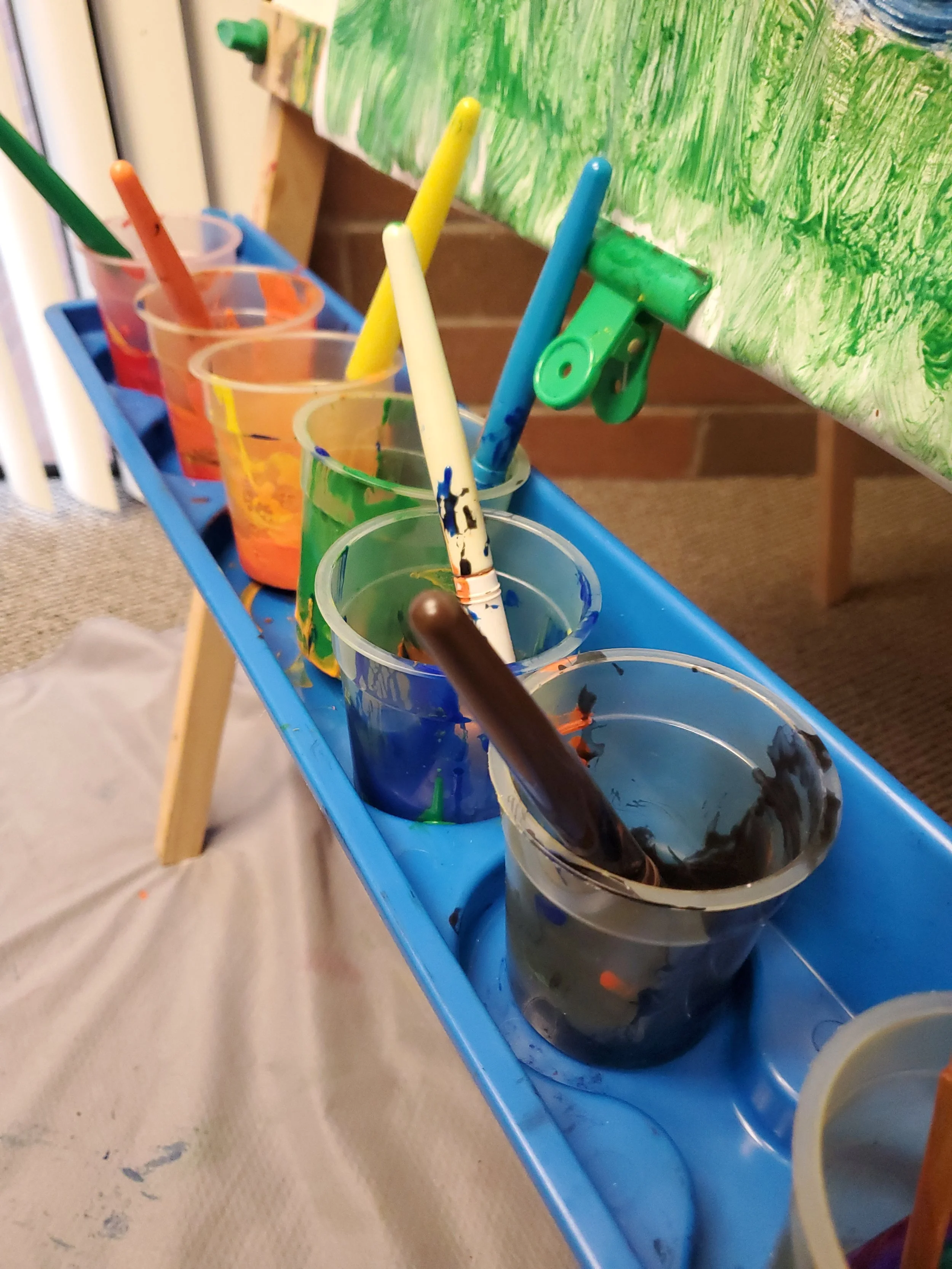 Working in the paint at Cascading Roots Child Counseling