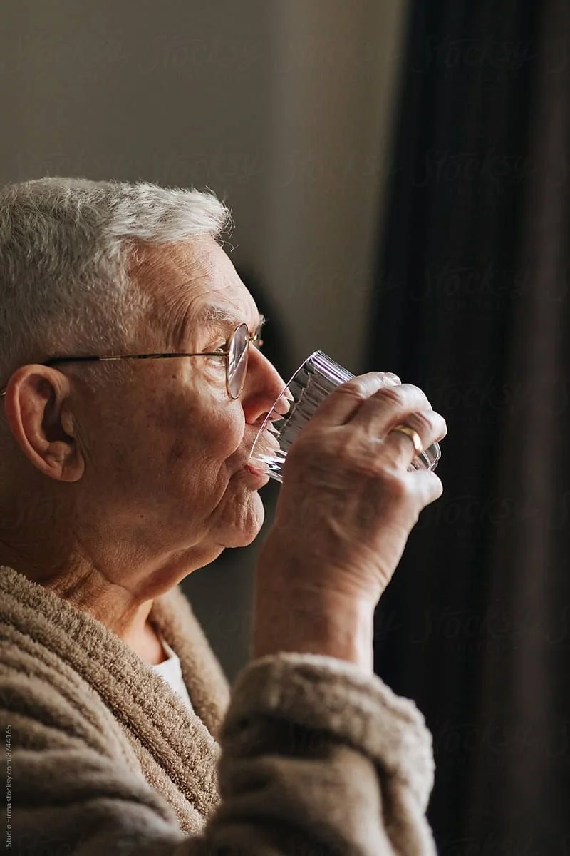 Senior eating meal safely after swallowing therapy treatment
