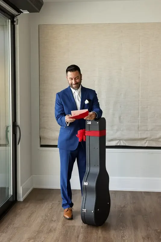 Groom Reading Letter from Bride