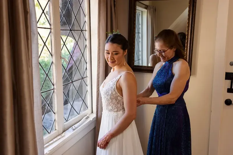 Bride getting ready with mother at Saint Clements Castle