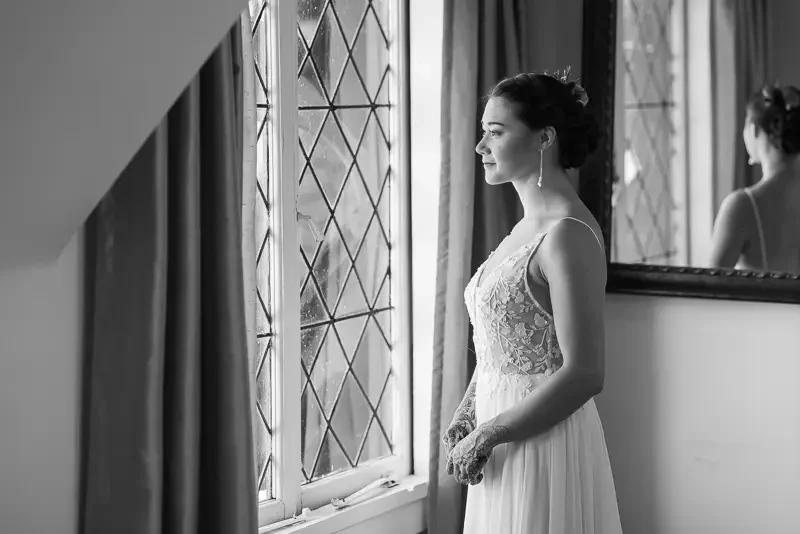Saint Clements Castle bridal portrait by window