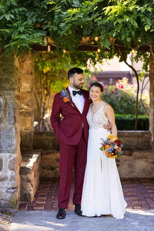 Saint Clements Castle wedding portraits under ivy-covered archway
