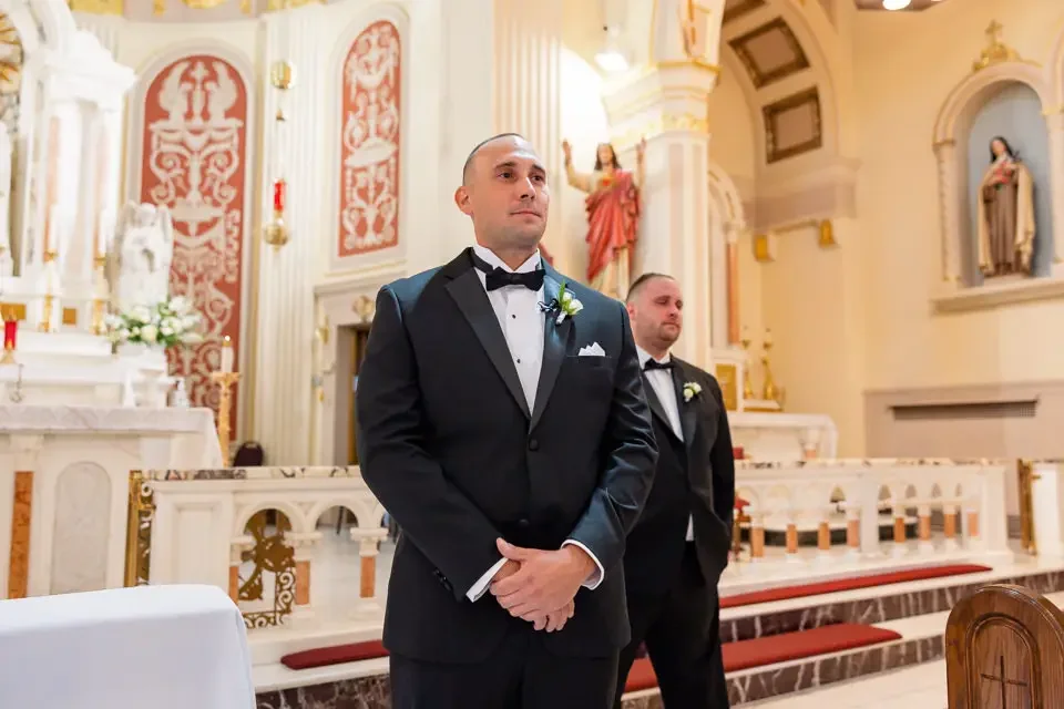 groom-waiting-at-altar-church-wedding.webp