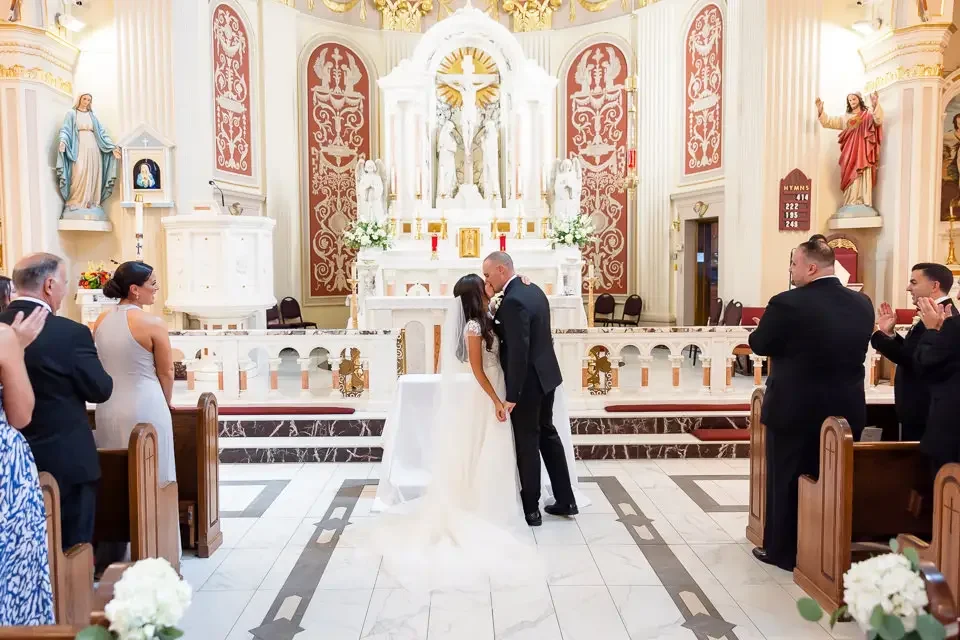first-kiss-church-wedding-ceremony.webp