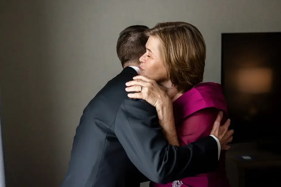 groom-hug-with-mother-wedding-day.webp